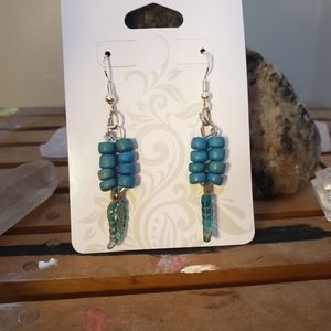 Handmade teal earrings with feather beads